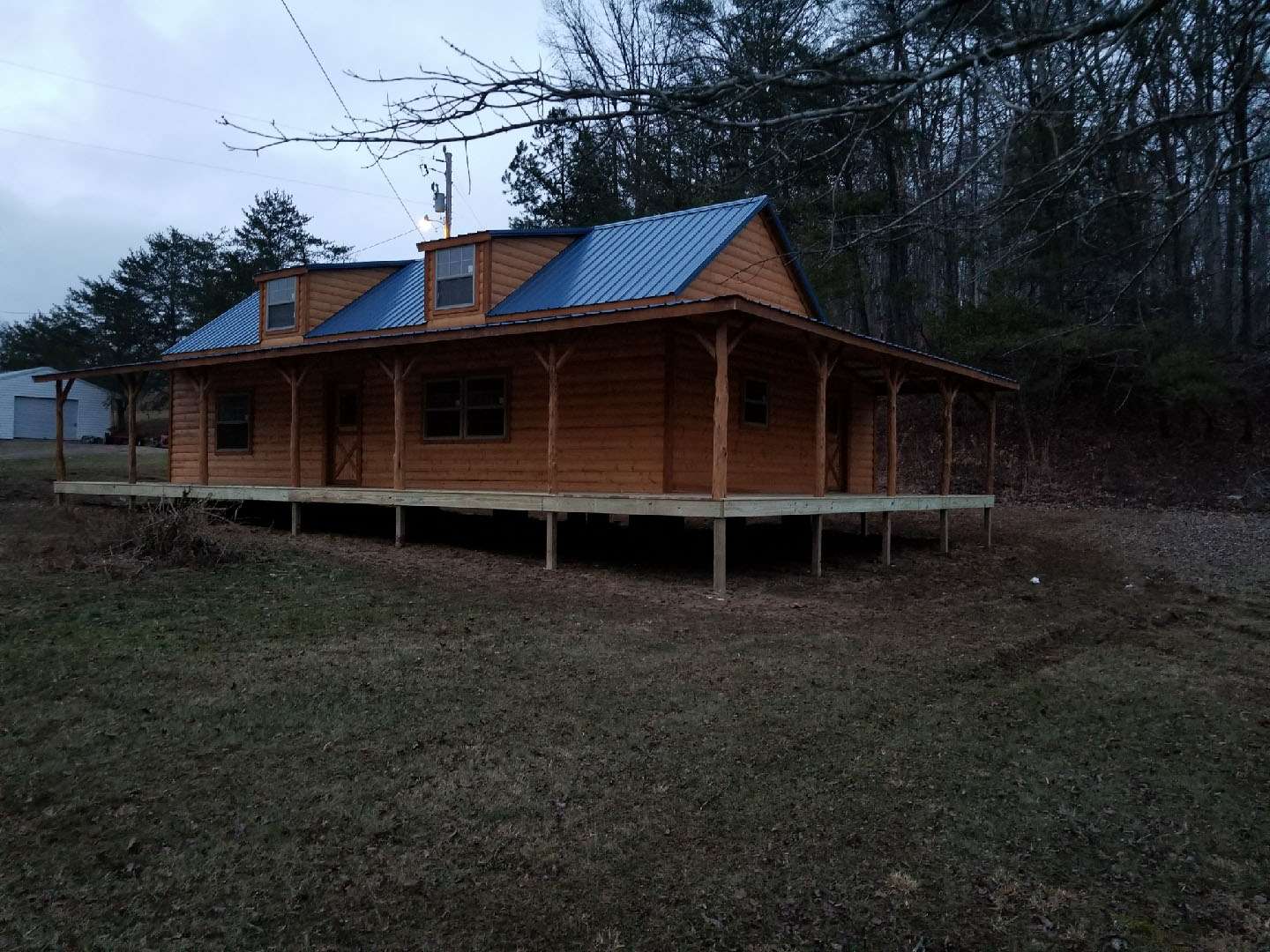 Cabin with front and side porch